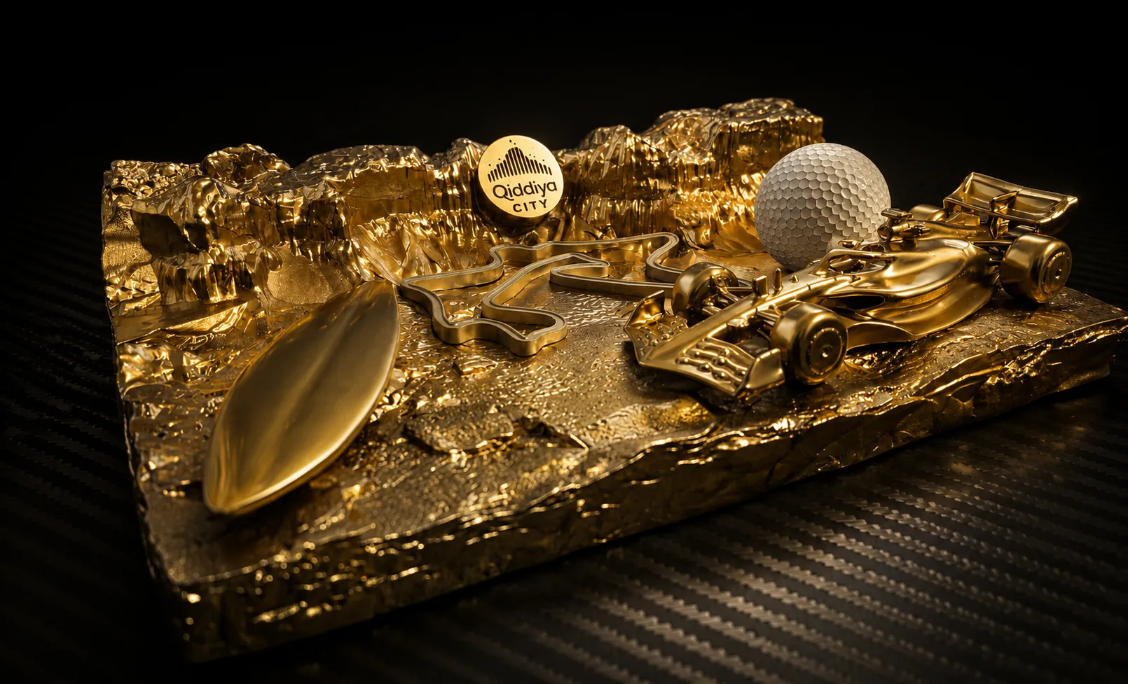 Gold Qiddiya giveaway with F1 car, 3D printed by The Monolith