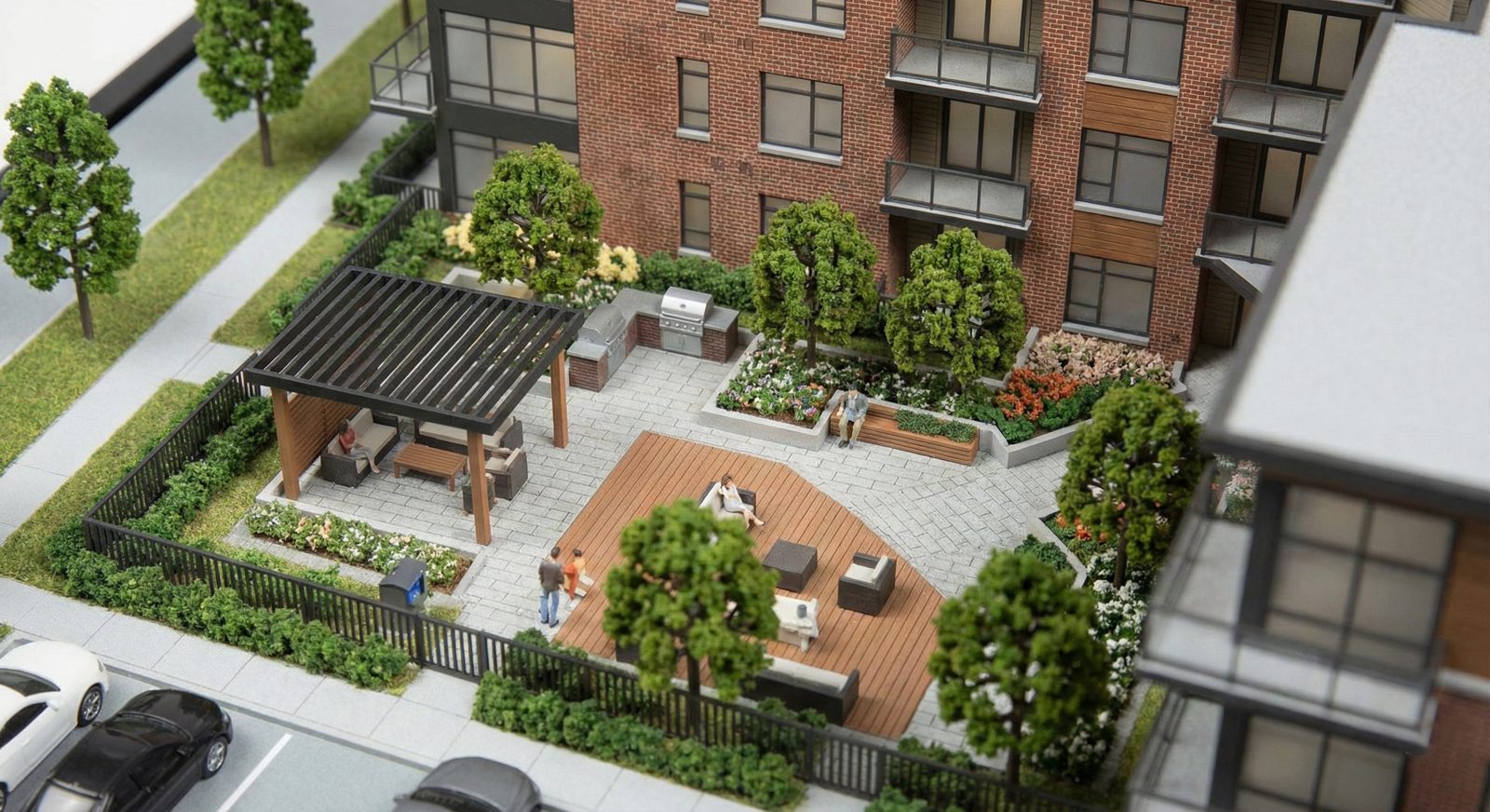 Detailed architectural scale model of a UK residential apartment courtyard with brick facade, pergola and landscaped public realm